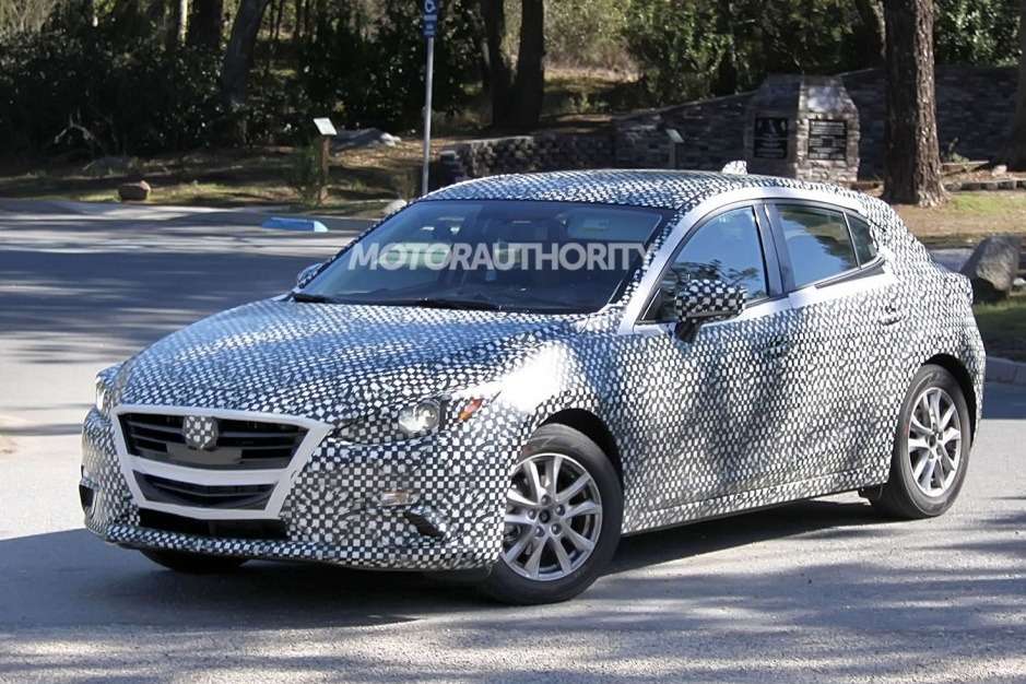 New Mazda3 hatchback test prototype side-front view_no_copyright