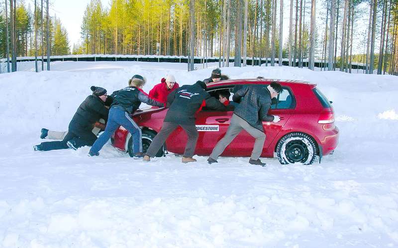 Sharing experience in winter tire testing with Bridgestone technicians in 2011 at the Arctic Falls test site in Sweden.  The Japanese get acquainted with the concept of 